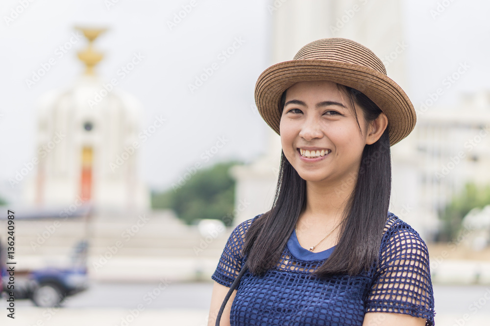 Happy female take a picture at Bangkok Democracy Monument - Concept of joyful travel , Democracy Monument in Bangkok.