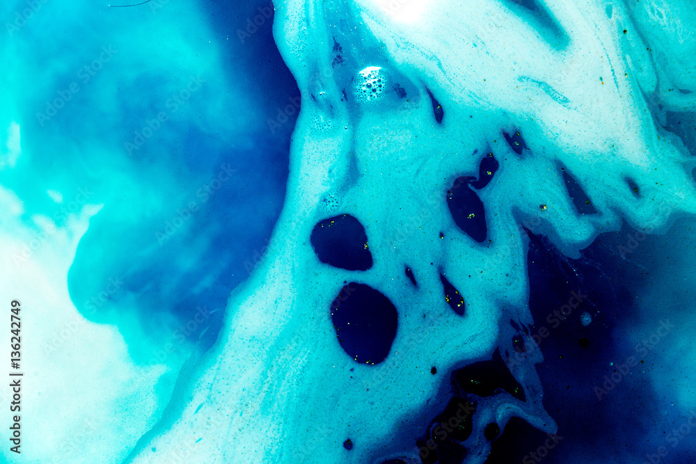 abstract background of ink dissolving in wate