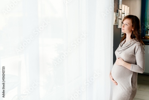 Pregnant woman in grey dress Free Download Pregnant woman in grey dress - GFXLoad