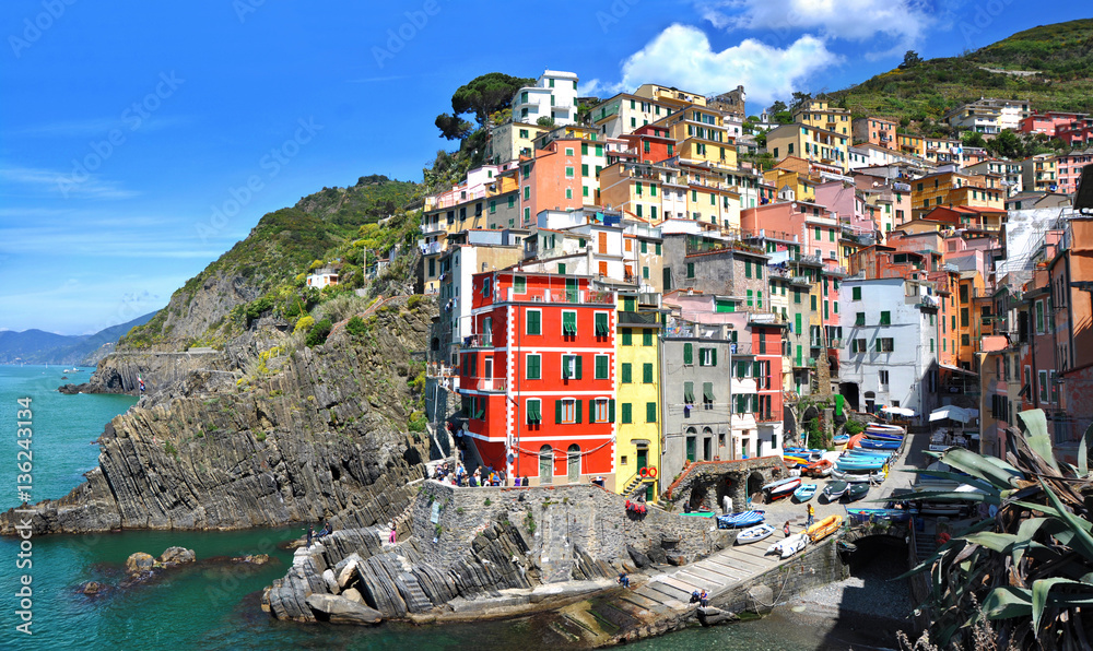 Riomaggiore fisherman village.Is one of five famous colorful villages of Cinque Terre National Park in Italy, suspended between sea and land on sheer cliffs. Liguria region of Italy.