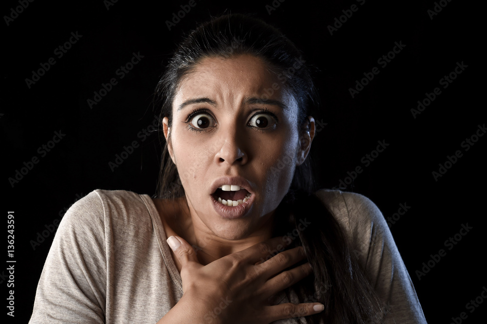 young beautiful scared Spanish woman in shock and surprise face