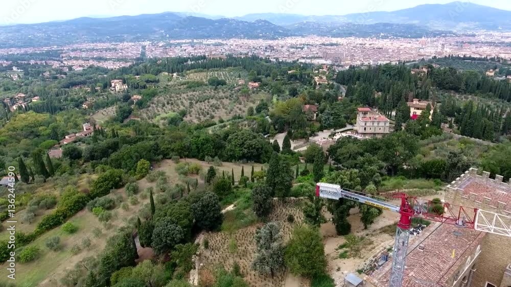 Aerial flight over Italy typical Tuscany landscape flying backwards over old castle and showing Tuscany hills a traditionally popular tourist destination Italy one of main tourist attraction 4k