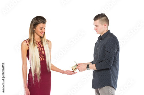 young man giving a american money,dollar young woman on white background