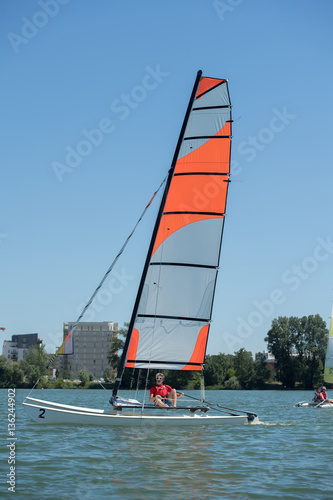 sailing on a lake - summer and sports theme