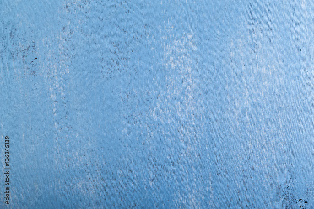 Blue wood background. Painted scraped wooden board. Grunge plywood texture or pattern.