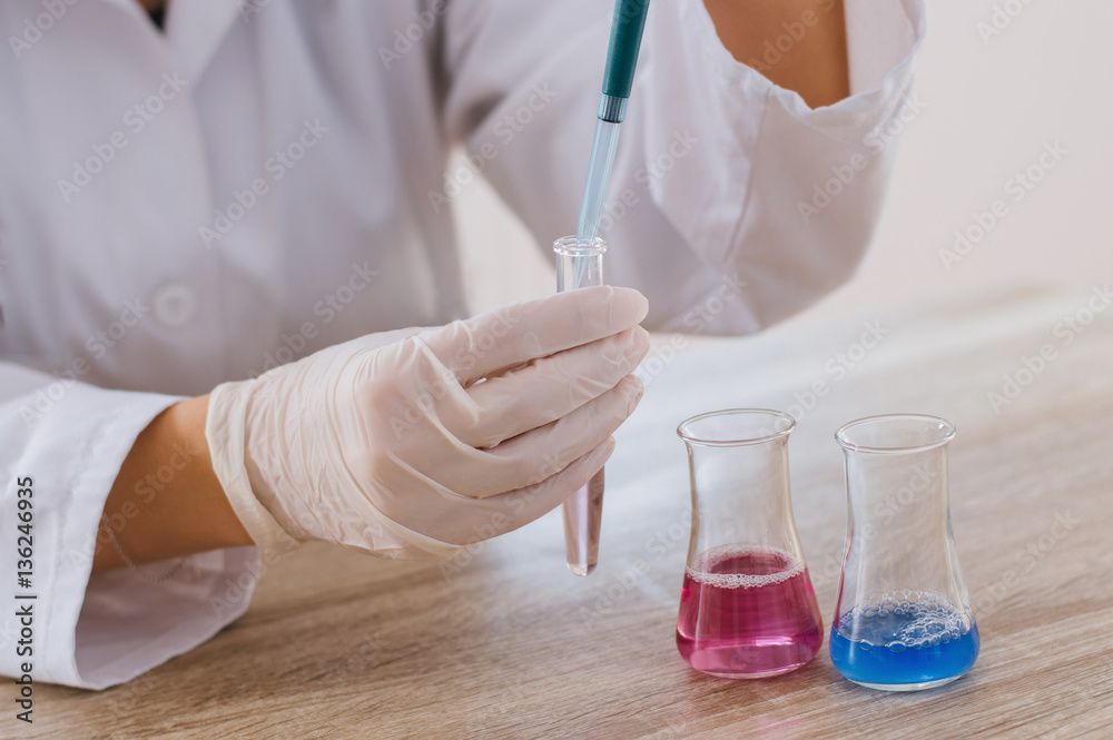 Fototapeta premium Laboratory assistant analyzing a test sample