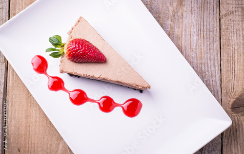 Chocolate cheese cake with strawberry and topping