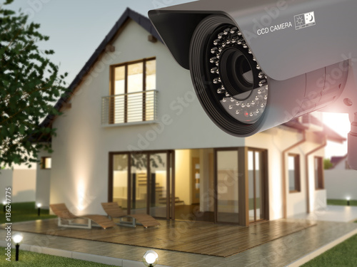 Security camera and home in the evening