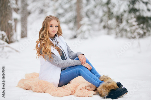 Girl in the winter forest.