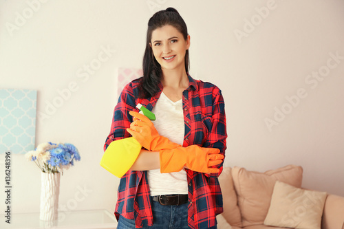 Young cleaner with spray bo...