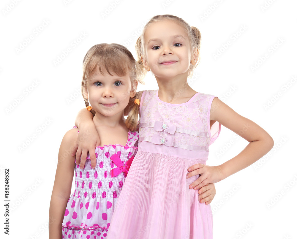 Adorable little girls in beautiful dresses isolated on white Adorable little girls in beautiful dresses isolated on white