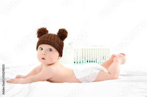 Cute baby wearing funny cap...