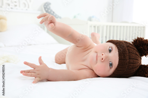 Cute baby wearing funny cap...