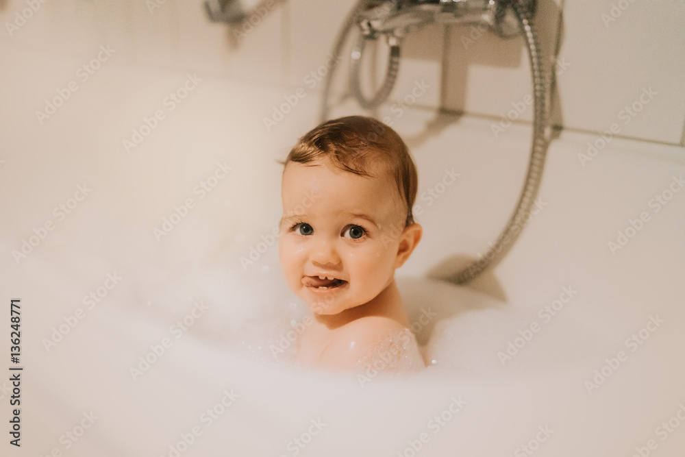 Happy newborn baby boy in bath Happy newborn baby boy in bath