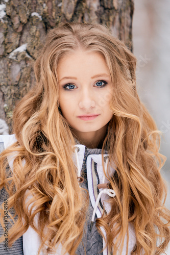 Girl in the winter forest.