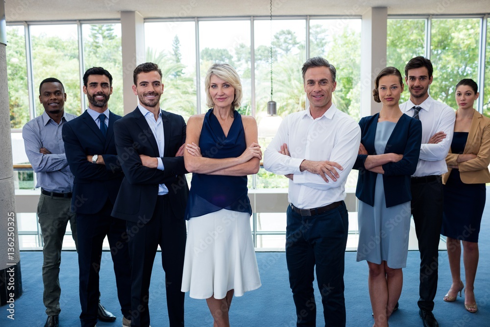 Fototapeta premium Business executives with arms crossed at conference center