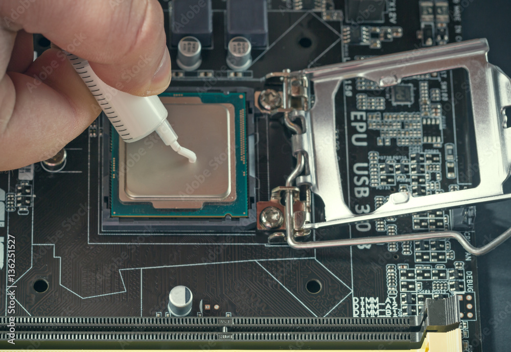 Applying thermal paste during CPU installation close up in the motherboard  Stock Photo | Adobe Stock