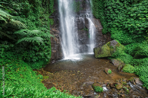 Waterfall is a beautiful. Tropical waterfall located in Bali