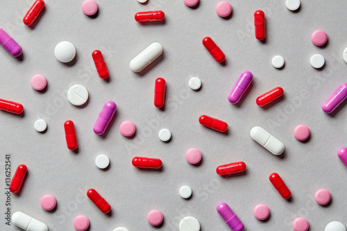 colorful pills on grey background