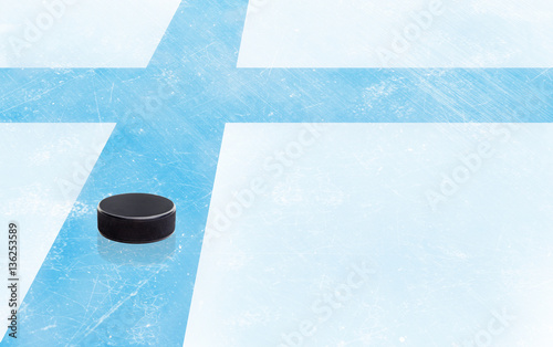 Photography Hockey Puck and Finland Flag on Ice With Copy Space