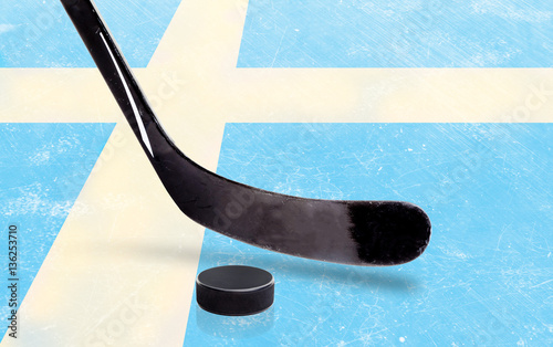 Hockey Stick and Puck With Sweden Flag on Ice