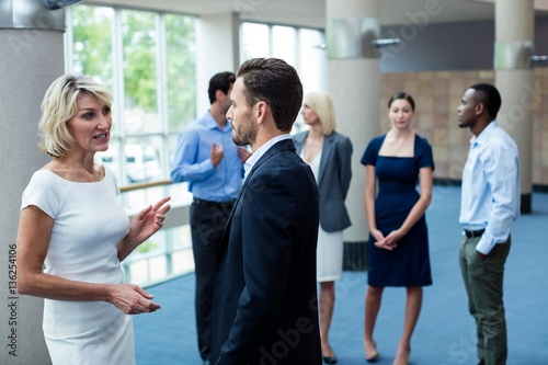 Business executives interacting with each other