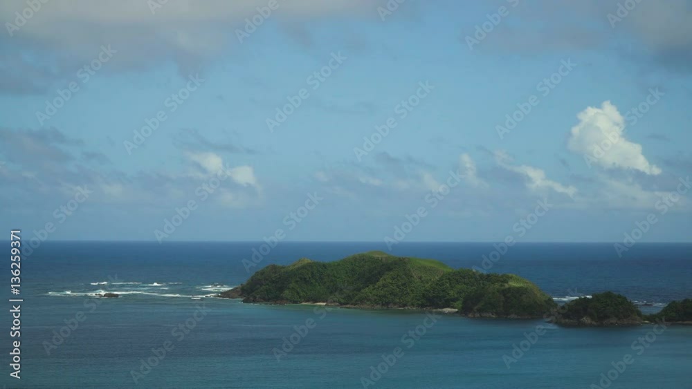 Seascape tropical island, lagoon, beach and hills.. Tropical landscape sky, clouds and mountains rocks with rainforest. Blue lagoon in the ocean. 4K video. Travel concept. Seascape tropical island, lagoon, beach and hills.. Tropical landscape sky, clouds and mountains rocks with rainforest. Blue lagoon in the ocean. 4K video. Travel concept.