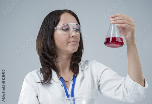 Medicine Concepts. Female Laboratory Staff Working with Flasks