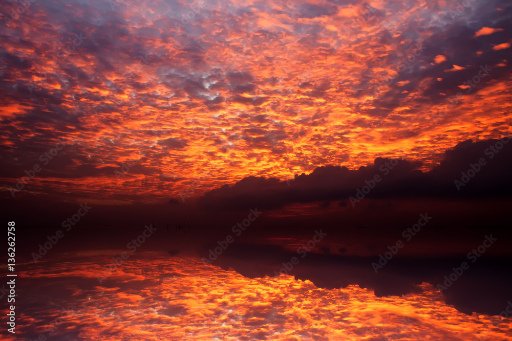 sunset sky with red cloud over the lake, thailand.