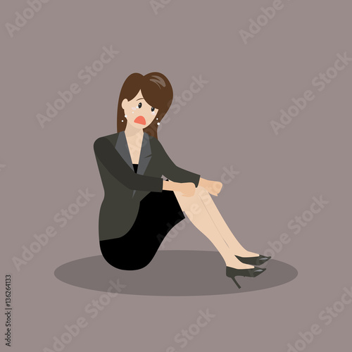Desperate business woman sitting alone