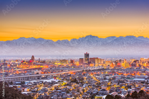 Toyama, Japan Skyline with Tateyama Mountain. photo