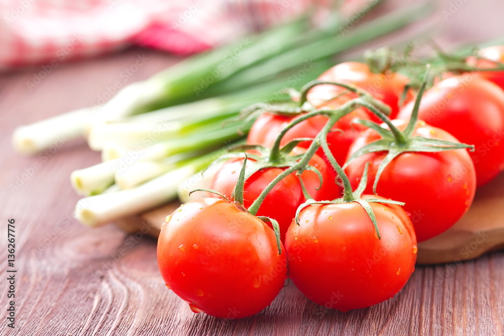 Fresh tomatoes and spring onion Fresh tomatoes and spring onion