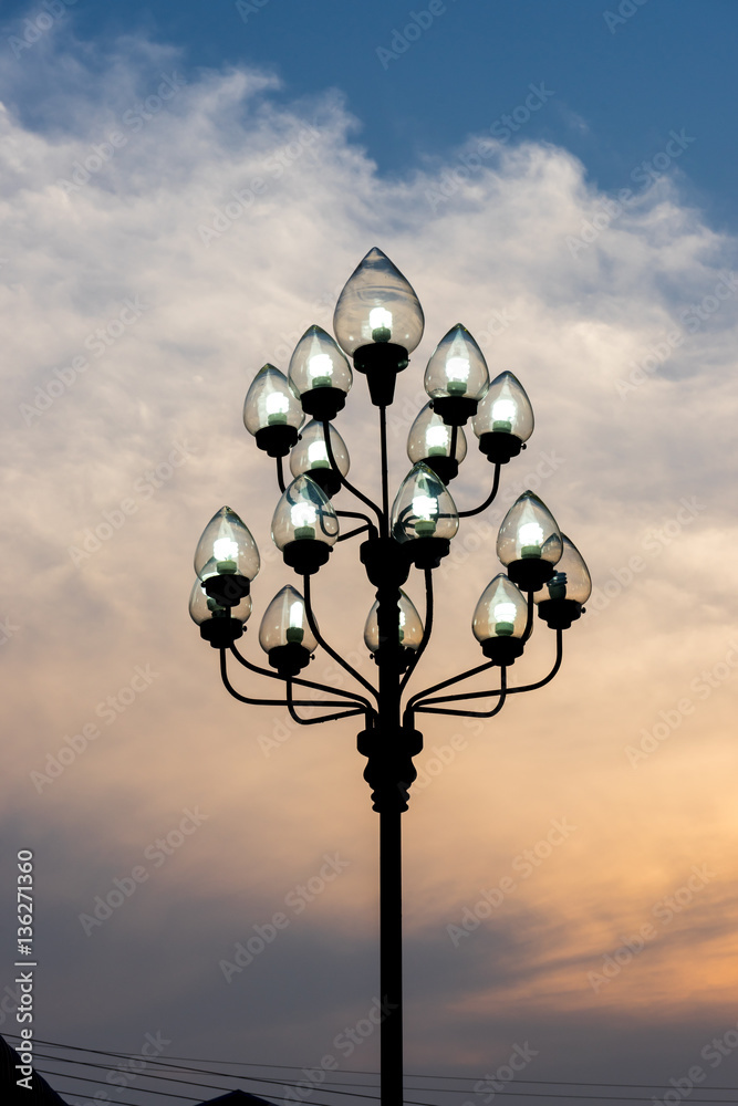 Silhouette of a light bulb at sunset Silhouette of a light bulb at sunset