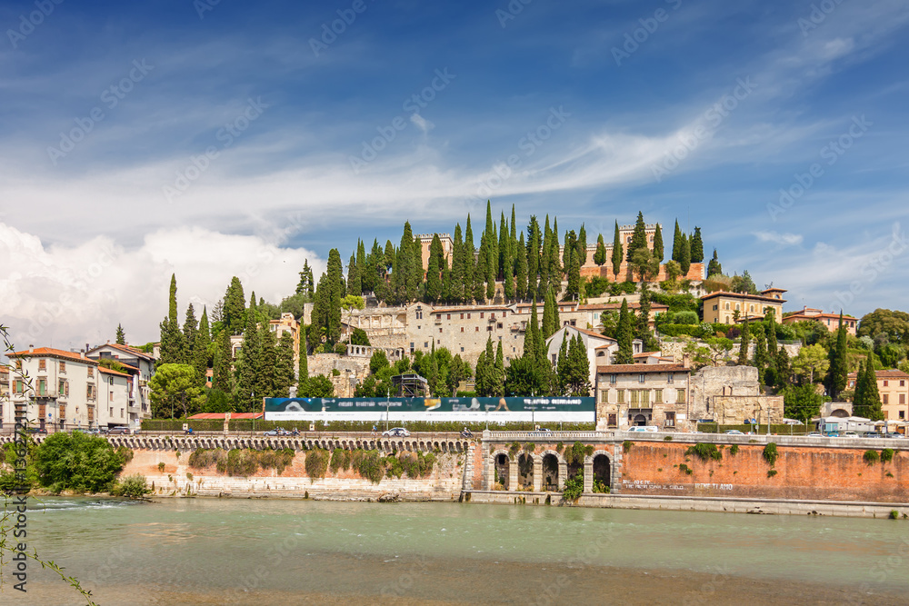 Sunny view of Adige river and Stone Bridge (Ponte di Pietra) in Verona, Veneto region, Italy.