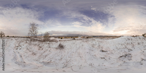 Full 360 degree equirectangula panorama snow-covered hills in the city