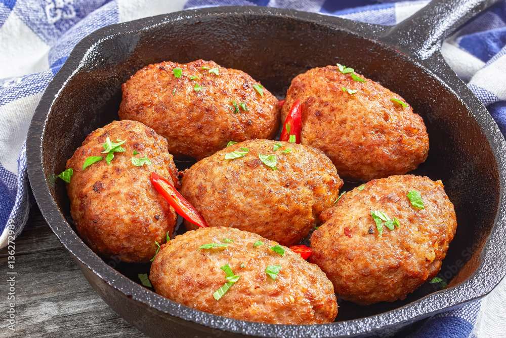 juicy delicious meat cutlets in iron frying pan juicy delicious meat cutlets in iron frying pan