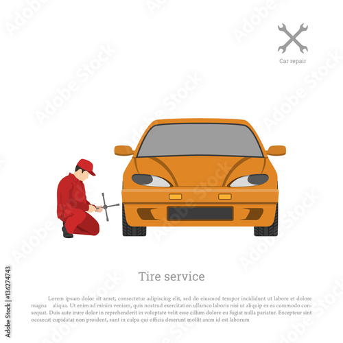Tire service. Mechanic changing a car wheel. Repair and maintenance. Vehicle workshop.