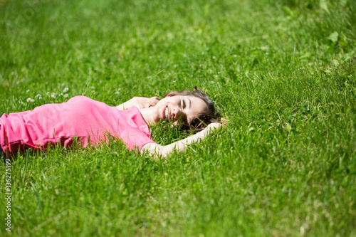 Beautiful happy woman on green grass. © BestForYou