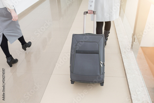 Business woman going with luggage or bag on her business trip