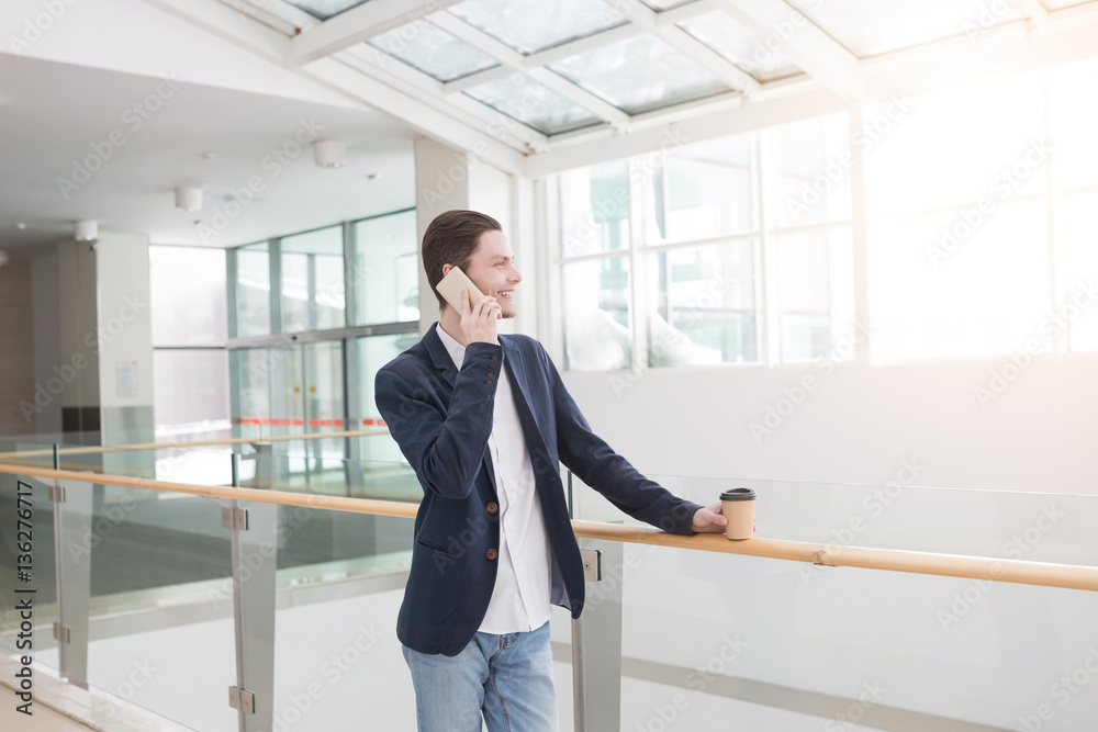 Portrait of young businessman with coffee and smart phone Portrait of young businessman with coffee and smart phone