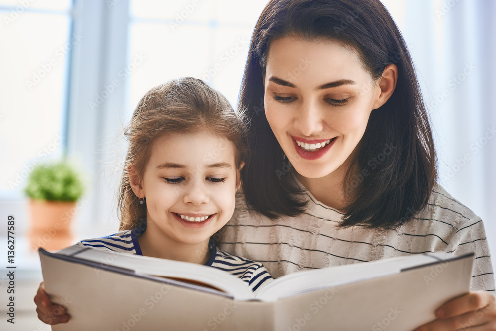 mother and daughter reading a book mother and daughter reading a book