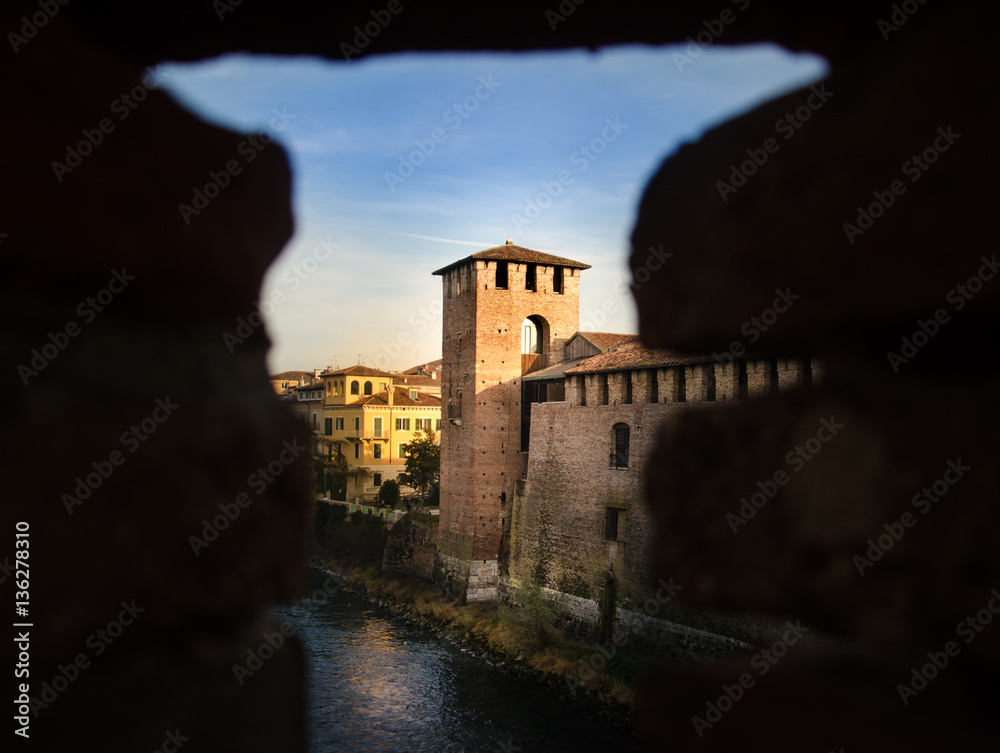 View through hole in wall on old tower in Verona, Italy - Sneak Peek