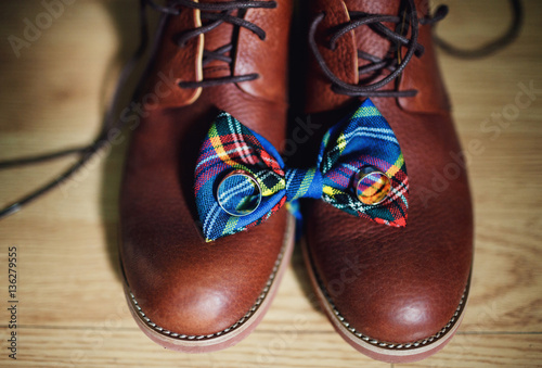 original brown shoes and bow prepared for the groom