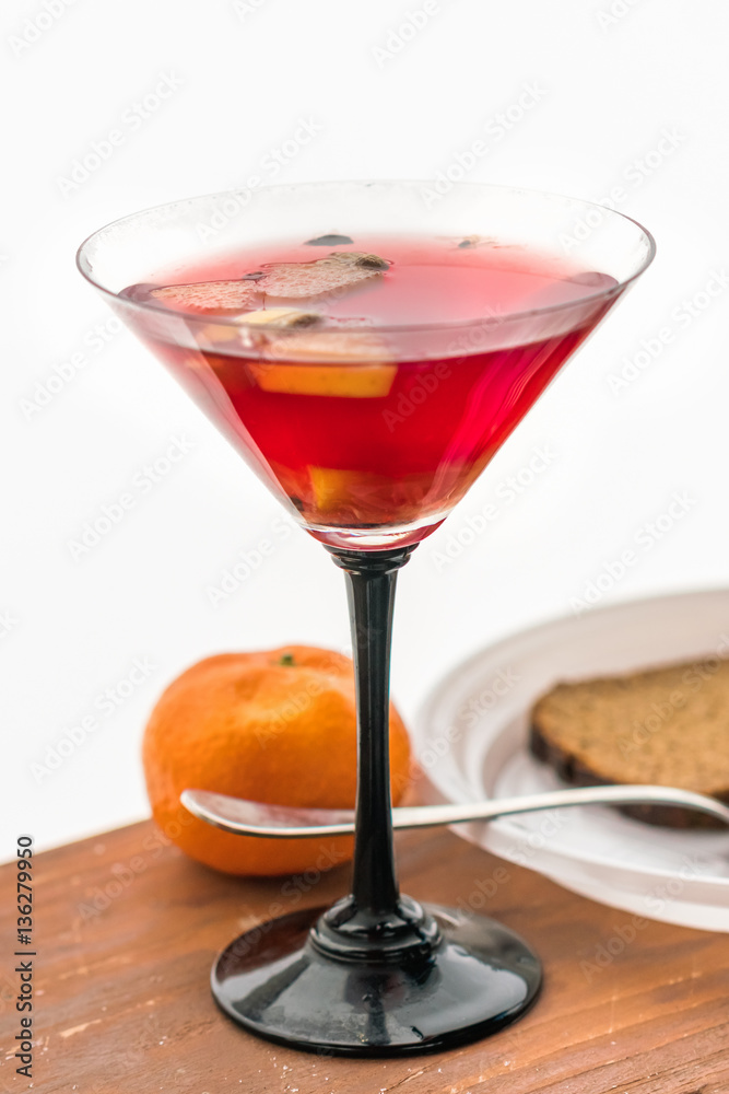 Glass of mulled wine on a snowy table Glass of mulled wine on a snowy table