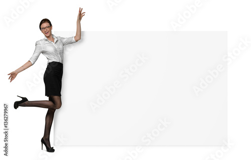 Happy woman in official clothing is holding a side of a blank banner isolated on white background © gearstd