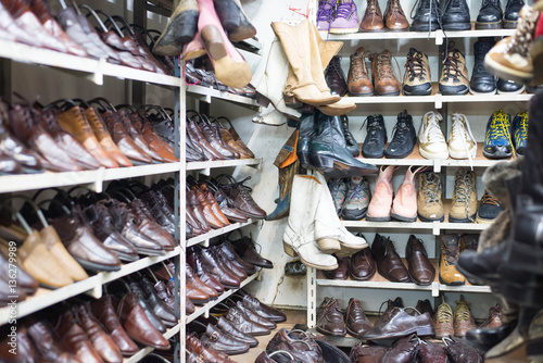 Shop of second hand leather shoes. Many used shoes for sale.