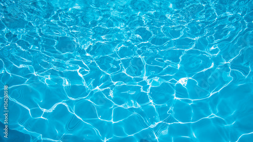 Blue and bright ripple water and surface in swimming pool