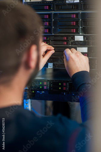 network engineer working in server room