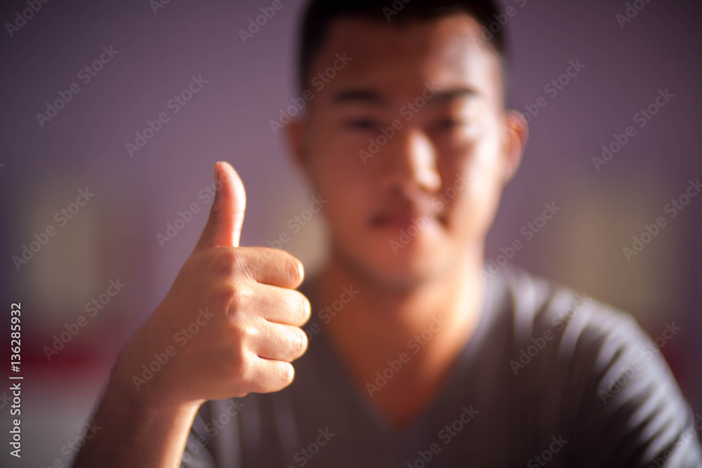 Good or Very good hand sign by asia man.Selective focus Good or Very good hand sign by asia man.Selective focus