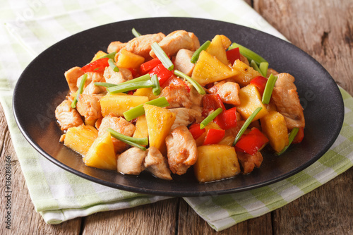 roasted chicken breast with pineapple and vegetables in sweet and sour sauce. horizontal